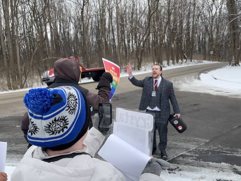 Patrick Sheridan, who said he's with the group Gays Against Groomers, gets into a shouting match with protesters on Saturday, Feb. 25, 2023, outside the Holiday Inn in Crystal Lake. A speaking event that hosted conservative activist Charlie Kirk was held at the hotel and drew protesters.