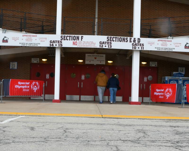 Participants of the polar Plunge enter Huskie Stadium in DeKalb on Saturday Feb. 21, 2026, before the start of the plunge.