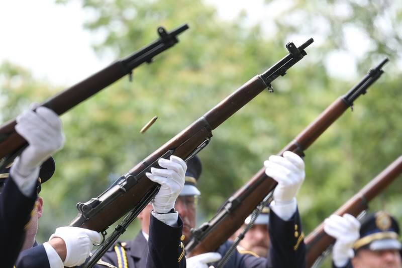Joliet Police Honor Guard does a 21-gun salute at a special Flag Day ceremony dedicating a memorial to remember the 28 World War II Submarines that traveled through Joliet on their way to the Pacific theater in Bicentennial Park on Wednesday, June 14, 2023 in Joliet.