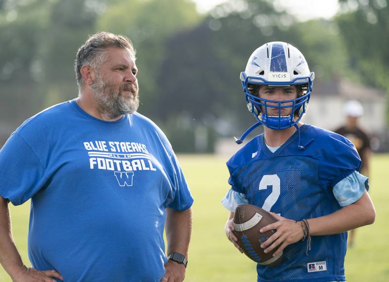 Woodstock head coach Michael Brasile talks with quarterback Jackson Lyons during a 7 on 7 football practice held on Thursday, July 21, 2022 at Crystal Lake Central High School. Ryan Rayburn for Shaw Local