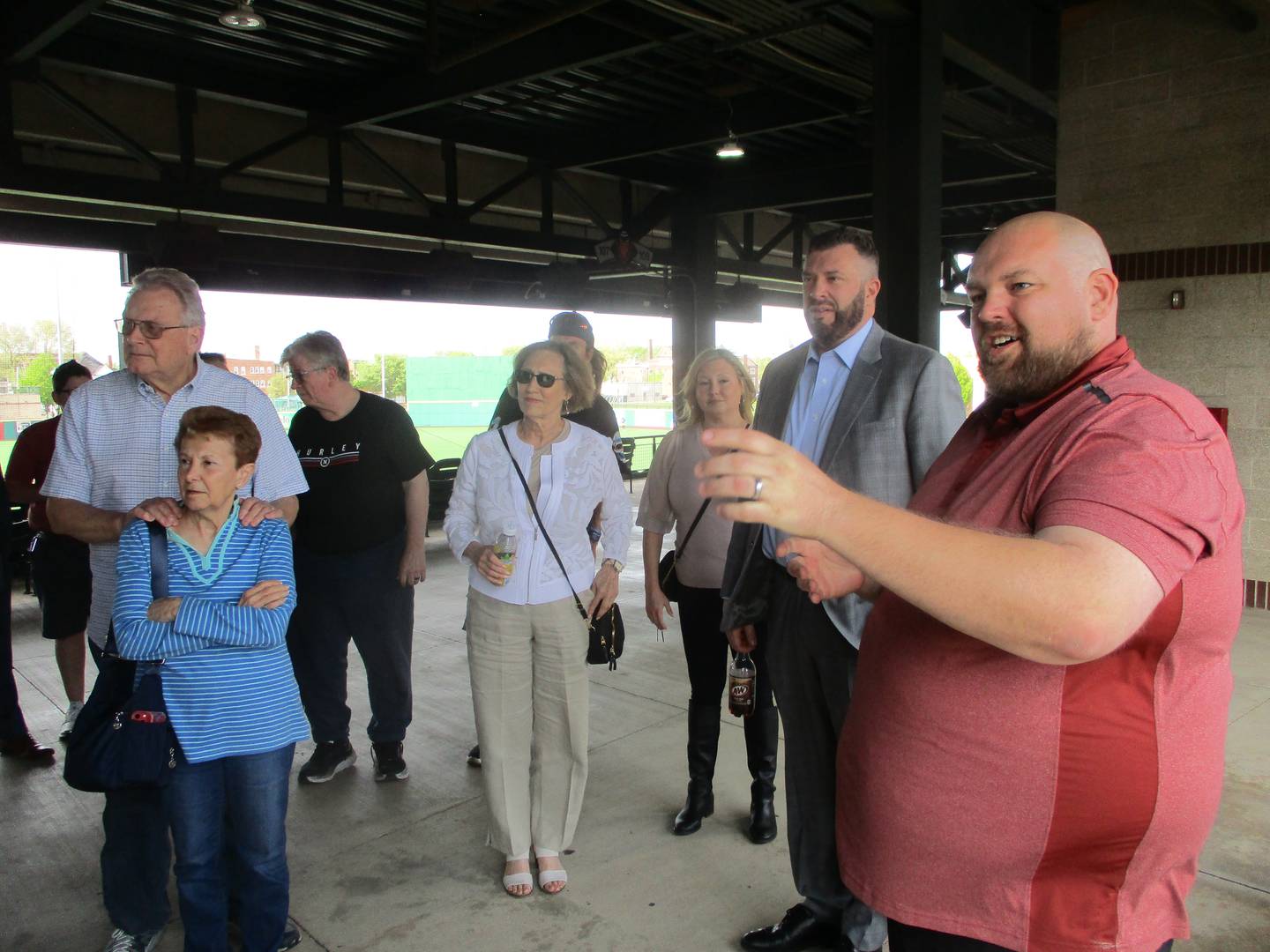 Joel Sigel, new food and beverage director for the Slammers, takes fans for a tour of the stadium concession stands on Friday, May 4, 2023.