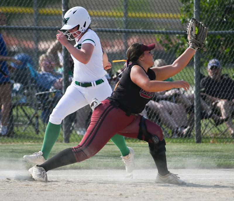 Rock Falls batter Patty Teague hustled down the line but was thrown out at first by inches as Richmond Burton's Norah Spittler squeezes the ball to make the play during sectional semifinal action Tuesday.