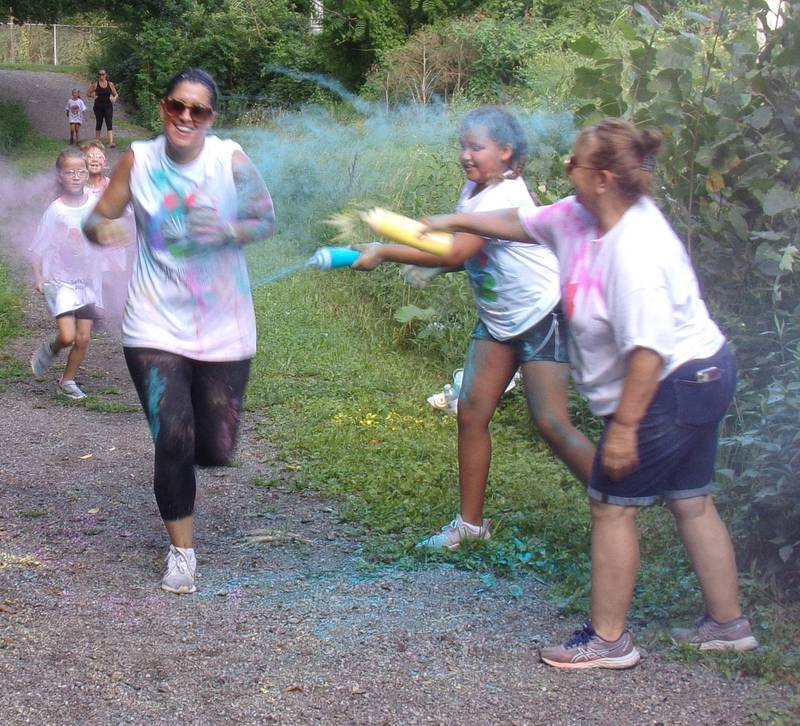 Runners were met with colored powder Saturday, Aug. 6, 2022, at the finish line of the inaugural Safe Journeys Color Run at Twister Hill Park in Streator.