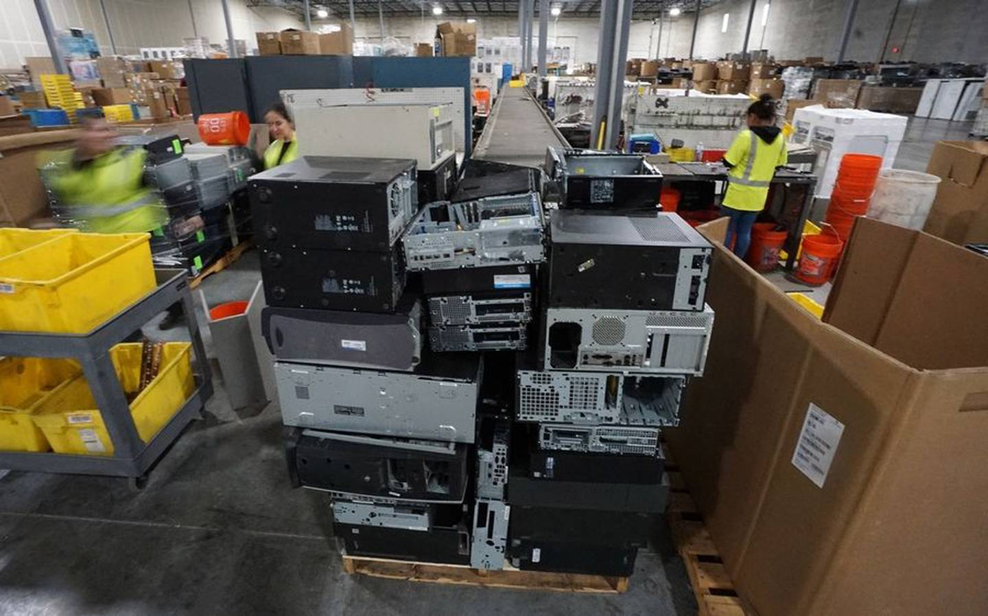 Steel computer chassis are stacked after being disassembled by Elgin Recycling workers at the company's electronics recycling processing facility in West Dundee.