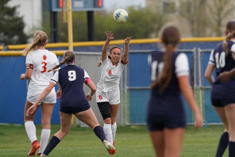 Oswego’s Natalie Braun (8) throws the ball in during a soccer match against Oswego East at Oswego East High School on Tuesday, April 23, 2024.
