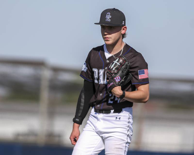 Oswego East's Nick Brennan (24) walks off the mound after getting out of an early jam during baseball game Oswego East at Oswego.  May 14, 2026 in Oswego.