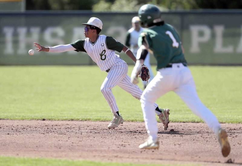 Grayslake Central's Ralph DeLeon tosses the ball to second to put out Crystal Lake South's Nathaniel Karbowski during the IHSA Class 3A sectional semifinals, Thursday, June 2, 2022 in Grayslake.
