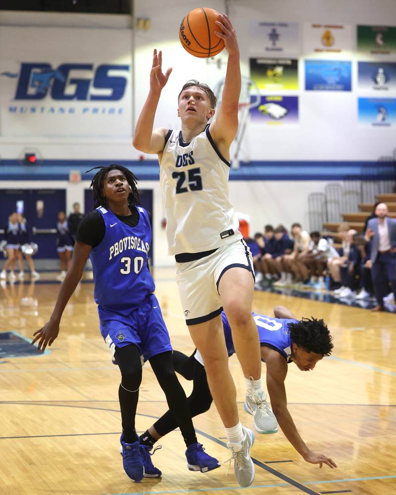 Downers Grove South's Daniel Sveiteris gets behind two Proviso East defenders for an easy basket during their game Friday, Feb. 14, 2025, at Downers Grove South High School.