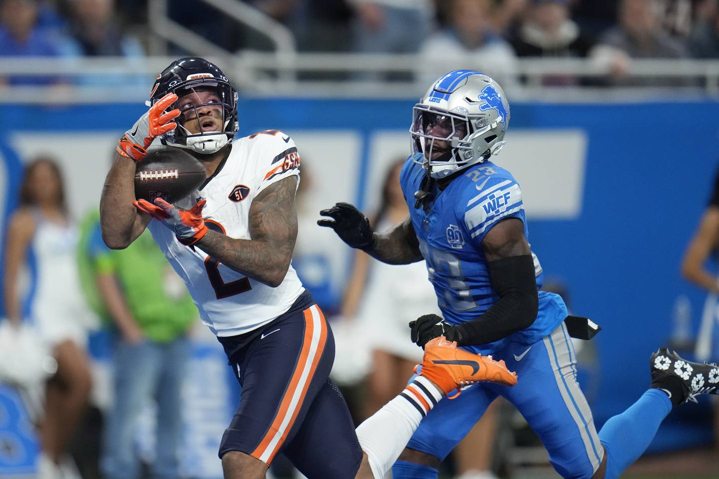 Chicago Bears wide receiver DJ Moore (2), defended by Detroit Lions cornerback Jerry Jacobs (23), catches a 39-yard pass for a touchdown during the second half of an NFL football game, Sunday, Nov. 19, 2023, in Detroit.