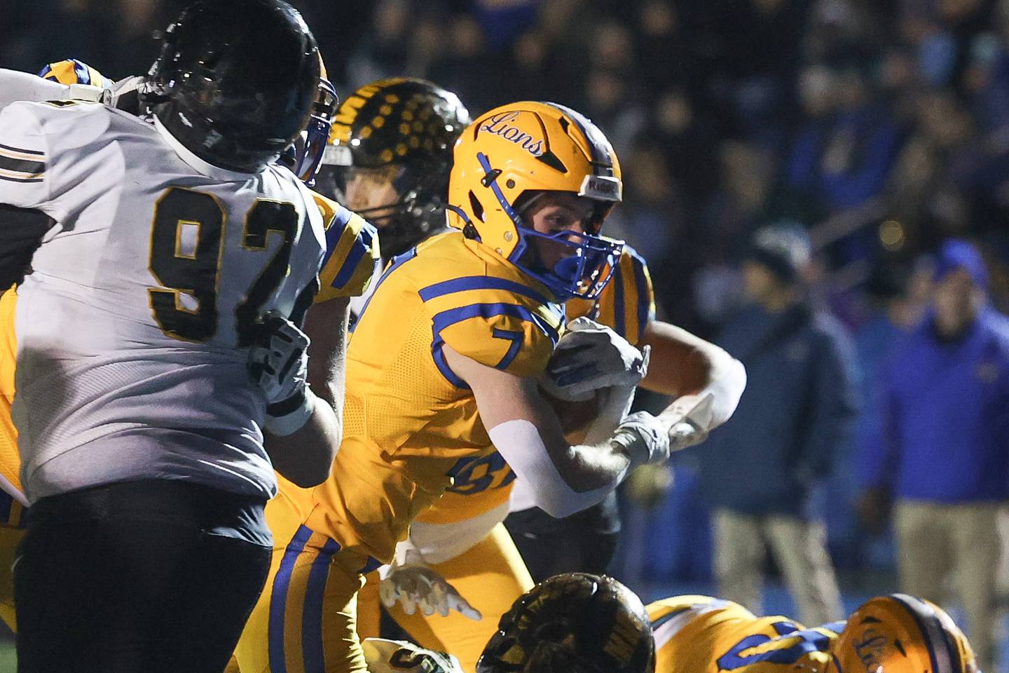 Lyons Township’s Danny Carroll powers his way in for a touchdown against Joliet West in the first round of the playoffs on Friday, Nov. 1, 2024 in La Grange.