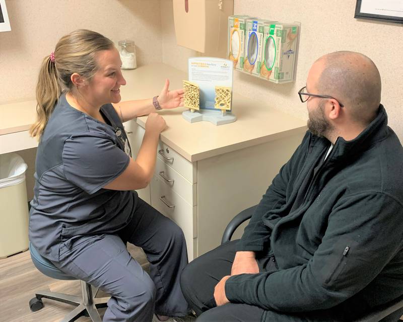 Nurse Practitioner Taelor Stuedemann discusses the risk factors and treatment options for osteoporosis with a patient in the Osteoporosis Management Program at the Morris Hospital Orthopedics & Sports Medicine office in Morris.