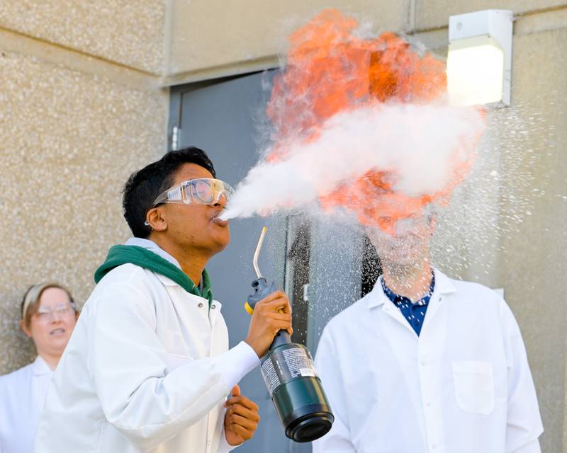 Chemical Engineer Harsha Koritala demonstrates the volatility of aerosolized corn starch for students from St. Charles North High School during a visit to Clarke Mosquito Control and Management on Thursday, Oct 16, 2025 in St. Charles.