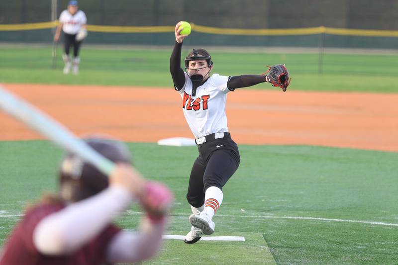 Lincoln-Way West’s Abby Brueggmann delivers a pitch against Lockport in the WJOL Softball Tournament championship game on Thursday, April 2, 2026 in Joliet.