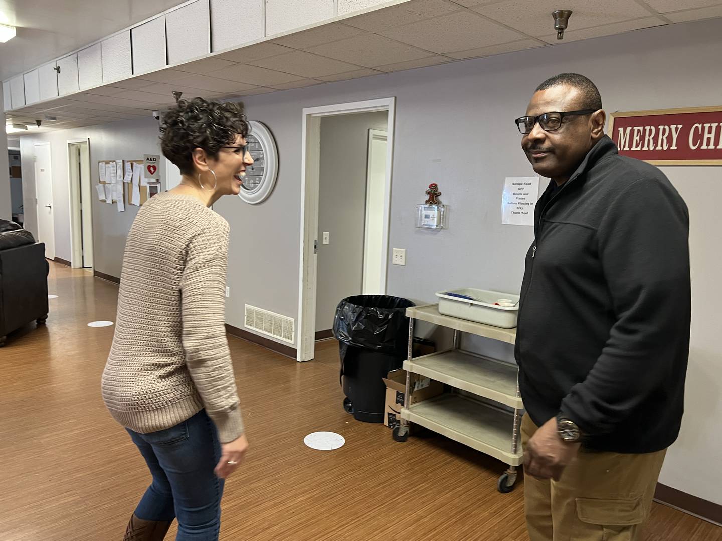 Angie Shoulis, Hope Haven's emergency shelter coordinator, and Gary Chapman, Hope Haven's Associate Director talk in the emergency shelter's women's common room on Jan. 6, 2023.