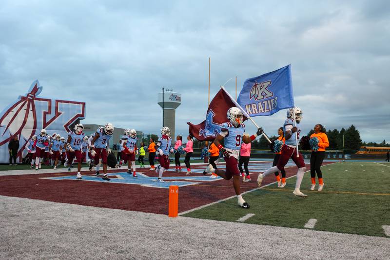 Kankakee players run onto the field ahead of the Kay's homecoming victory over Bloom on Friday, Oct. 10, 2025.