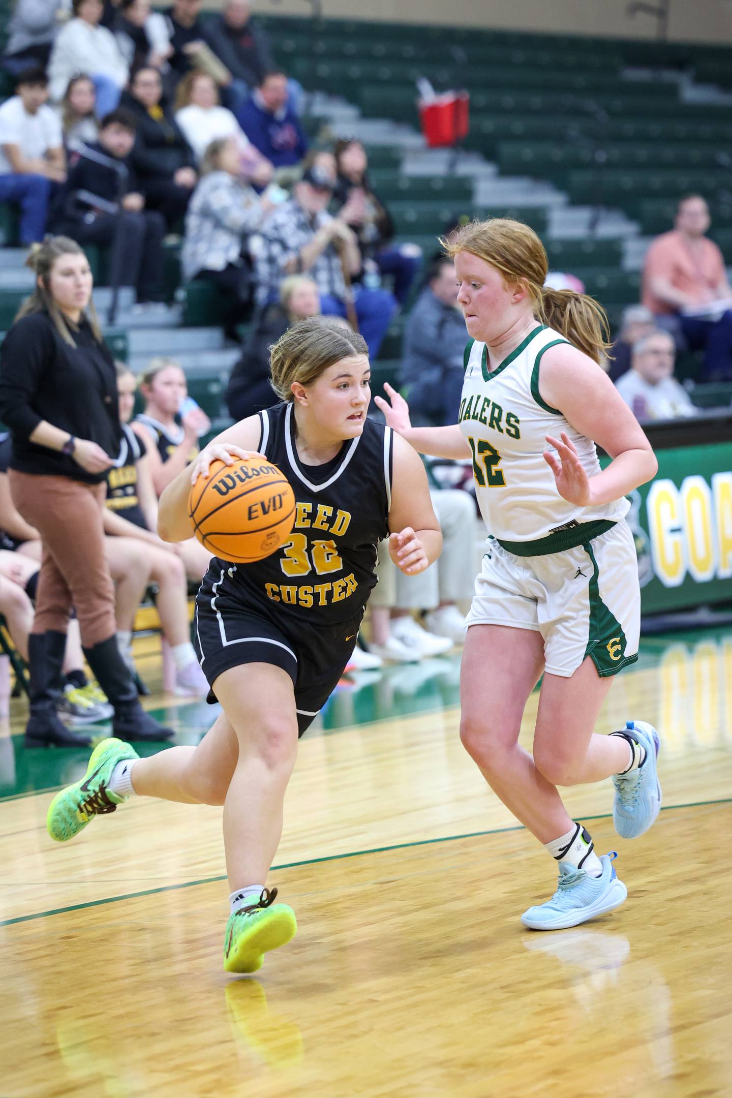 Reed-Custer's Harlie Liebermann dribbles to the lane against Coal City's Jori Tucker during the Comets' 50-43 victory over Coal City on Monday, Jan. 11, 2026.