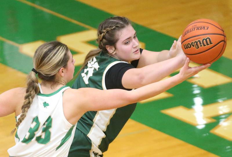 St. Bede's Savannah Bray grabs a rebound over Seneca's Audry McNabb on Monday, Jan. 29, 2024 at Seneca High School.
