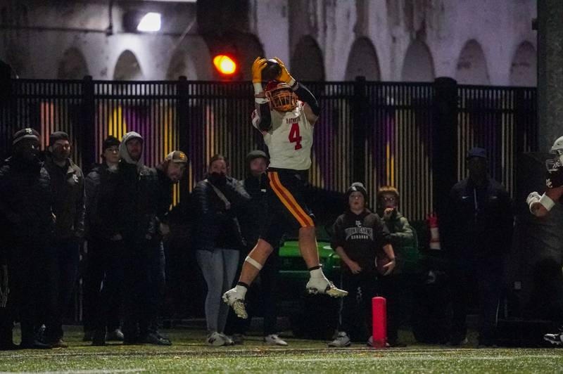 Batavia's Charlie Whelpley (4) catches a pass for a touchdown against Mt. Carmel during a class 7A semifinal football playoff game at Mt. Carmel High School in Chicago on Saturday, Nov 18, 2023.