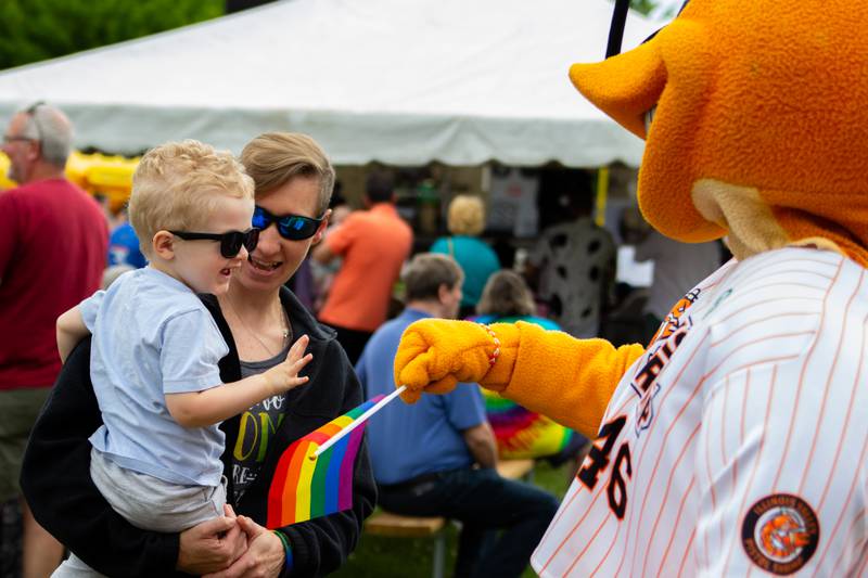 Fan Fist Bumps “South Claw Sam” Mascot of Pistol Shrimp on Saturday, June 8, 2024 at Jordan Block Park in Ottawa.