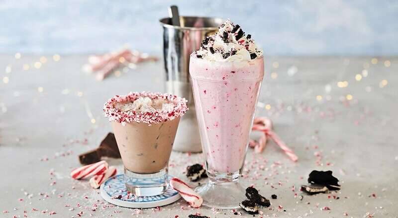 The Tipsy Santa cocktail and Oreo Candy Cane Milkshake are available at participating Red Robin restaurants during the holiday season.