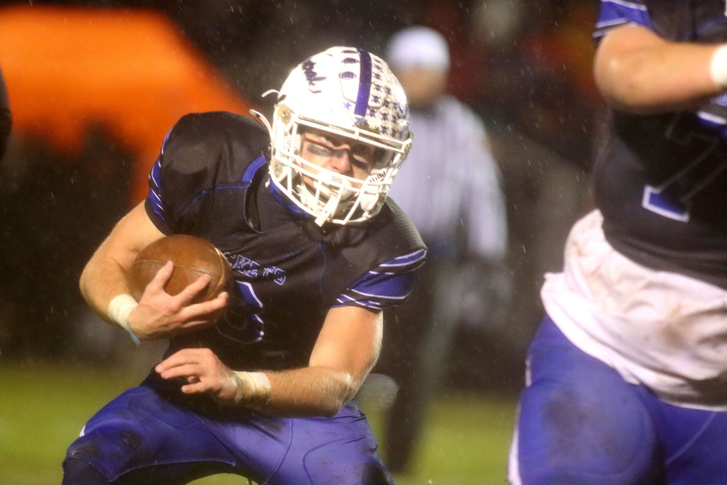 Burlington Central’s Tyler McGladdery moves with the ball against Harlem in IHSA football Class 6A second-round playoff action at Central High School in Burlington on Saturday, November 8, 2025.