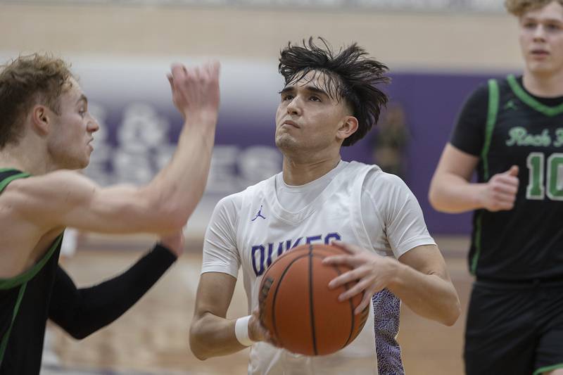 Dixon’s Wyatt Wetzell looks to put up a shot against Rock Falls Tuesday, Feb. 7, 2023.