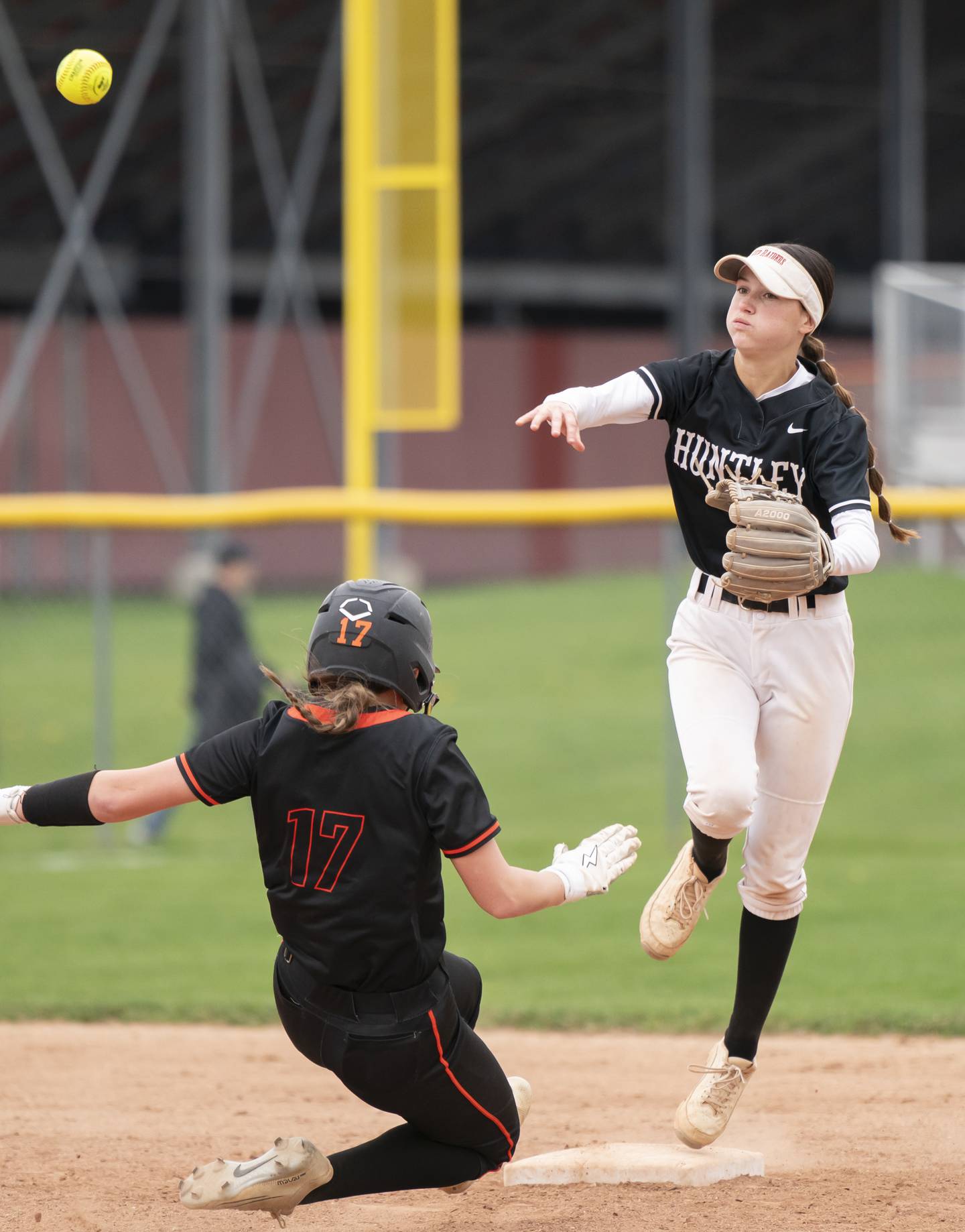 Huntley's Aubrina Adamik throws to first base after getting the out on McHenry's Elyse Fullington at second base during their game on Wednesday, April 30, 2025 at Huntley High School. Ryan Rayburn for Shaw Local