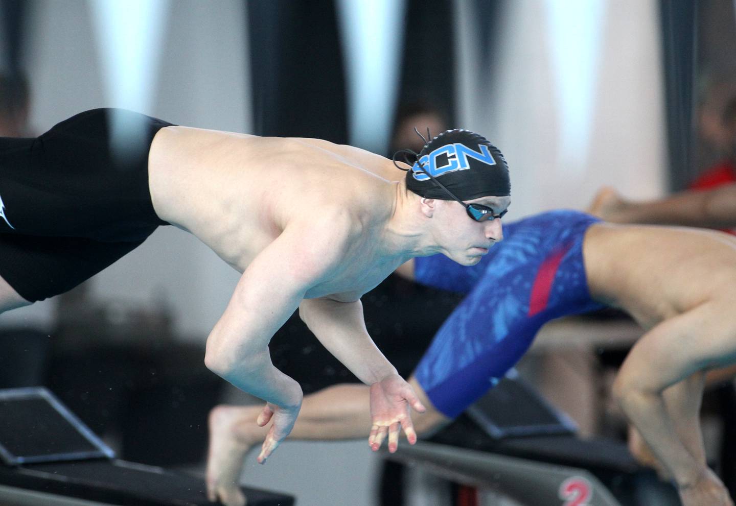 St. Charles North’s Aleksej Filipovic takes off from the blocks for the championship heat of the 100-yard butterfly during the IHSA Boys Swimming and Diving Championships at FMC Natatorium in Westmont on Saturday, Feb. 26. 2022.