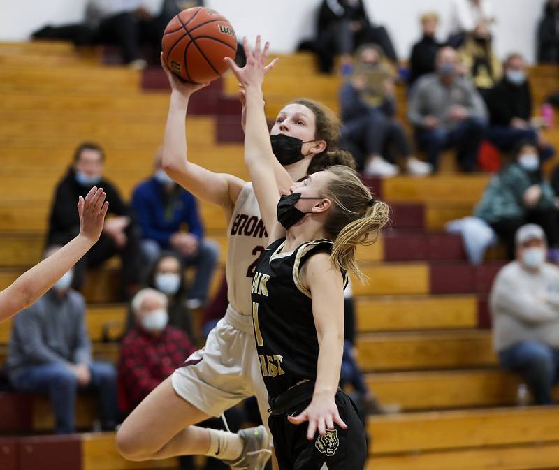 Montini’s Sawyer White (2) goes for a layup against Oak Forest’s Olivia Baxa (11) during a game at Coach Kipp’s Hoopfest in Lombard on Saturday, Jan. 15, 2022.