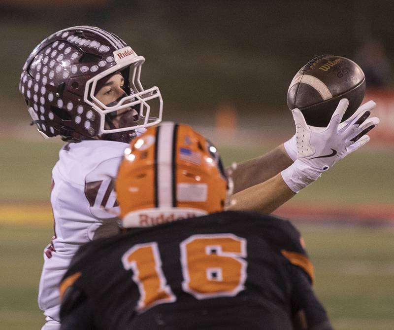 Tolono-Unity's Tyler Henry hauls in a pass in front of Byron’s Andrew Talbert Friday, Nov. 28, 2025, in the Class 3A football finals at Hancock Stadium at ISU.