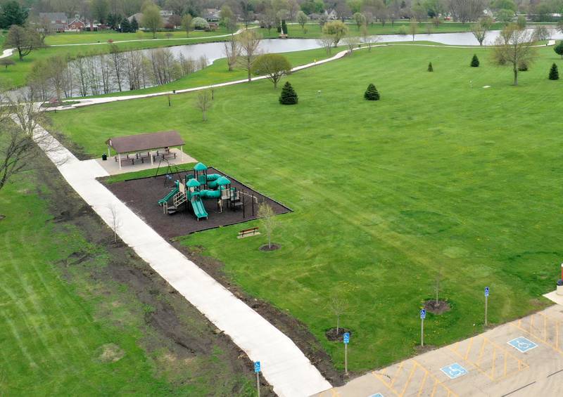 An aerial view of the walking path on Thursday, April 16, 2026 in Peru. The project is now complete and open to the public. Construction work began last October and included a 10-foot-wide concrete path, with secondary concrete paths also added, connecting the new parking lot near Lighted Way to the parking lot, playground, and shelter on the west side of Baker Lake. The new path is 2 feet than the current one.