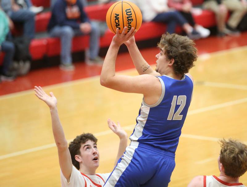 Princeton's Asa Gartin lets go of a shot over Ottawa's Colt Bryson on Monday, Feb. 3, 2025 in Kingman Gymnasium at Ottawa High School.