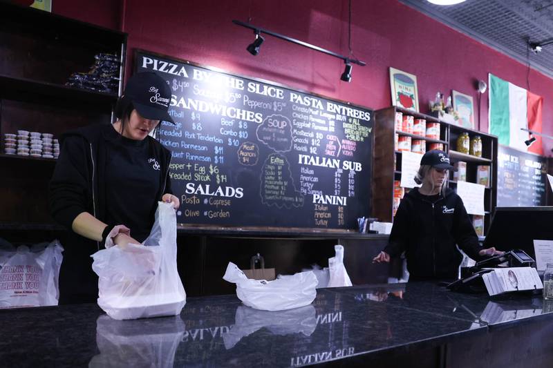 Hannah Finnestad, left, and her sister, Joanna, work on orders at Big Sammy’s Italian Eatery in downtown Plainfield. Friday, Feb. 25, 2022, in Plainfield.
