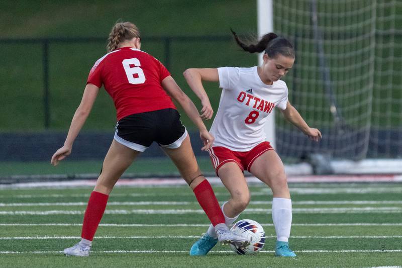 Natalie Zimmerman (6) Of Metamora attempts to kick ball between legs of Georgia Kirkpatrick (8) of Ottawa on Tuesday, May 21, 2025 at Malone Field in Metamora.