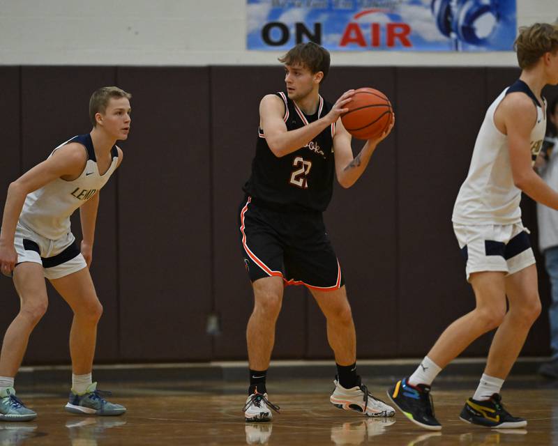 Minooka's Nick Andreano (22) looks to pass the ball in the WJOL Basketball Tournament on Monday, November 21, 2022, at Joliet.