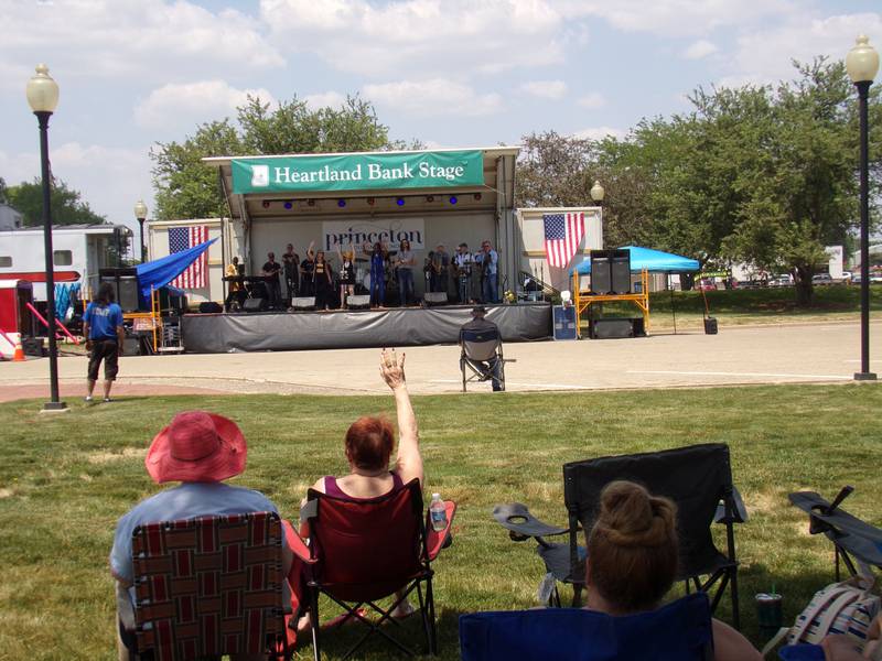 Spectators react to a funky set of music from Brass from the Past on Saturday, June 3, 2023, during the Shrimp and Brew Hullabaloo at Rotary Park in Princeton.