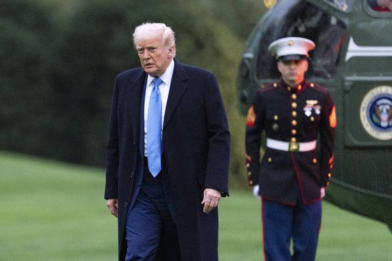 President Donald Trump walks on the South Lawn as he arrives at the White House on Marine One, Sunday, April 6, 2025, in Washington. (AP Photo/Manuel Balce Ceneta)