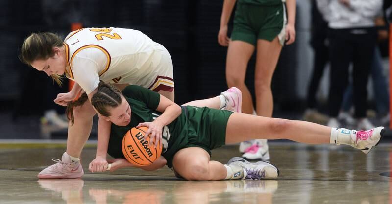 Grayslake Central's Madison Hoffmann, lower, gets fouled by Montini's Peyton Farrell during the Hersey Class 3A supersectional on Monday, March 3, 2025 in Arlington Heights.