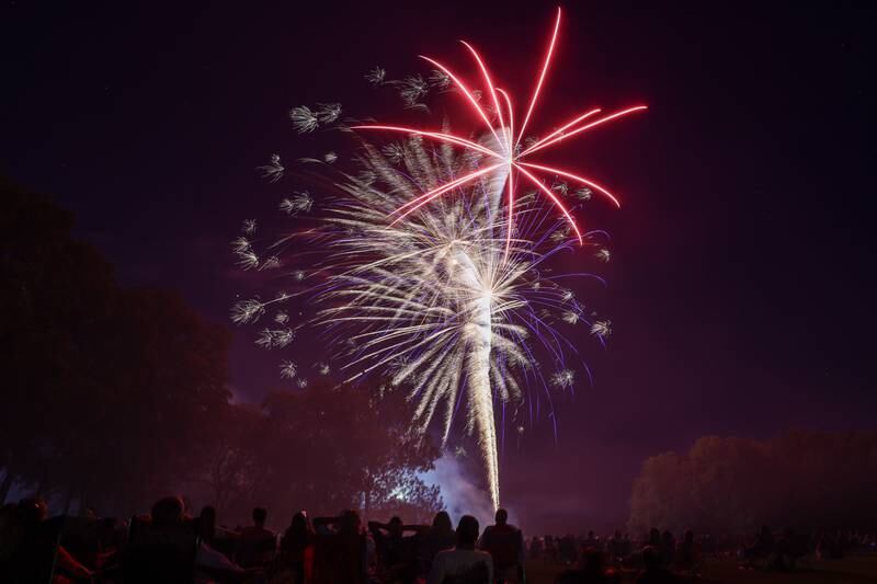 Spectators watch the city of Kankakee's fireworks show at Kankakee Community College on Friday, July 4, 2025.