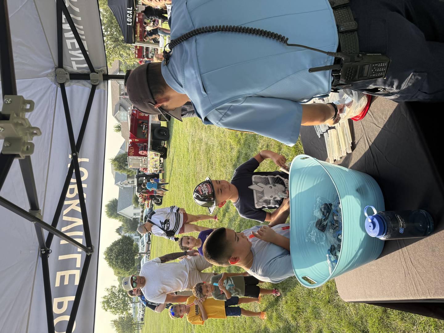 Yorkville Police Department Community Service Officer Tyler Madsen greets kids during the National Night Out event in Yorkville.