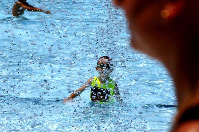 Aaron Appel, 6, plays in the water while swimming on Friday, June 21, 2024, at Woodstock Water Works.