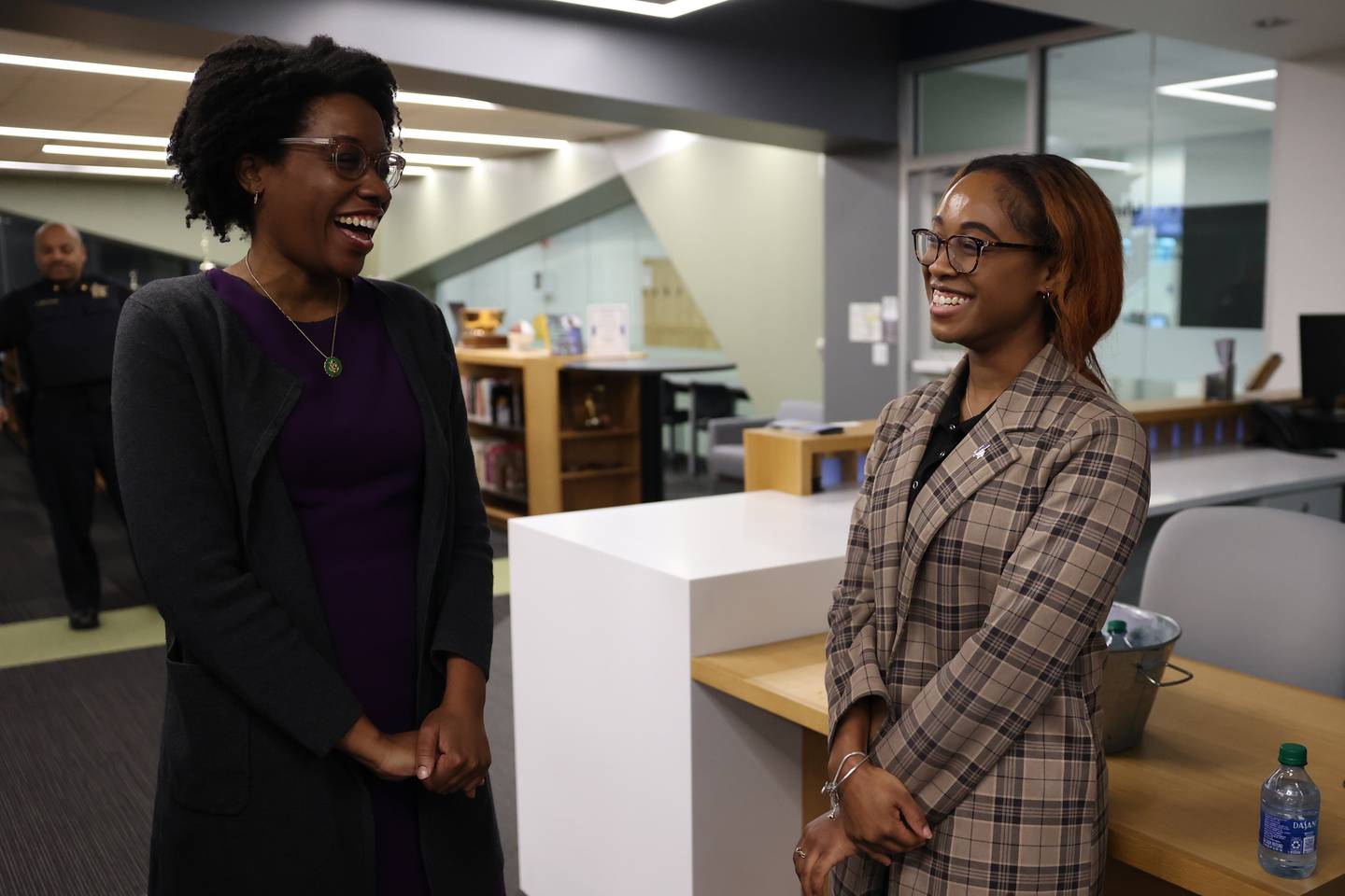 Congresswoman Lauren Underwood talks with Iyisha Ellis, a Joliet Junior College student and business owner of Zoe Apparel, at the City Center Campus in Joliet.
