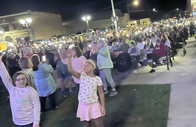 An estimated crowd of 2,500 turned out to listen to Fortunate Sons, a Creedence Clearwater tribute band, on Friday, Aug, 29, 2025 in Mt. Morris. Concertgoers used their cell phone flashlights during the song "Long As I Can See the Light".