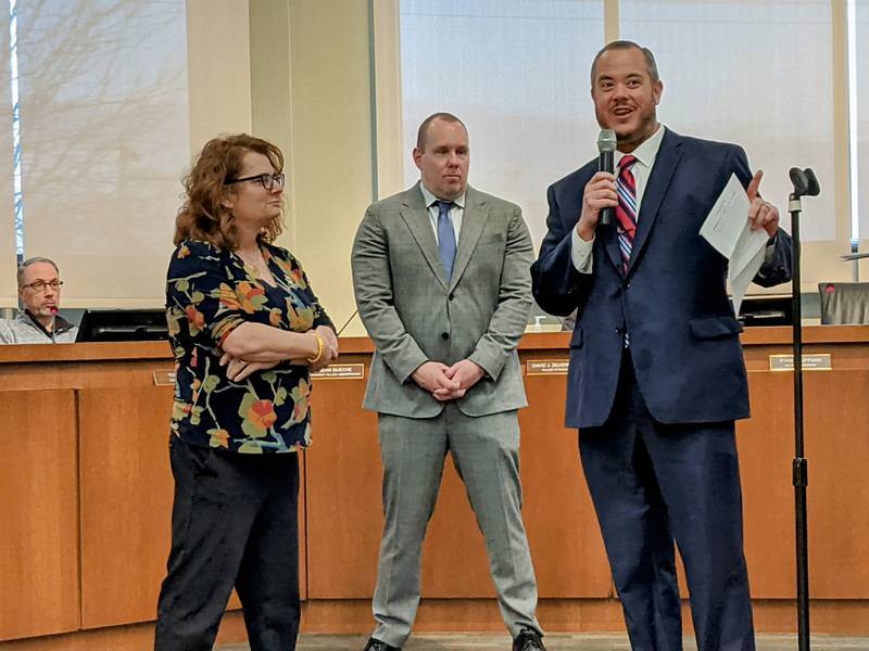 During the April 8 Oswego Village Board meeting, Oswego Village President Ryan Kauffman, middle and Oswego Village Administrator Dan Di Santo, right, thank retiring Oswego public works director and village engineer Jennifer Hughes, left.