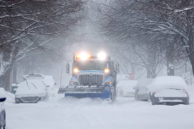 A snow plow clears Oneida Street. Wednesday, Feb. 2, 2022, in Joliet.
