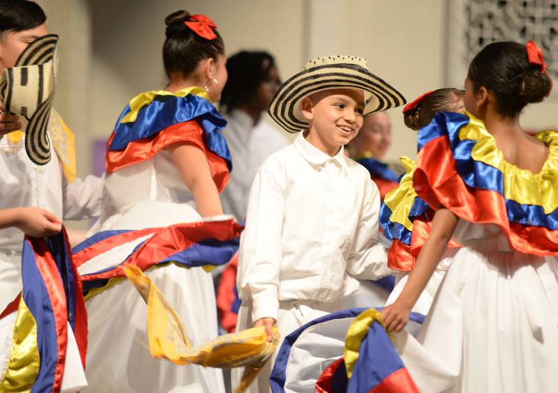 Forest Road students including 2nd grader Sebastian Ramirez dance to the sounds of Columbia while participating in the  Expo De Bellas Artes held at Park Junior High Friday April 21, 2023.