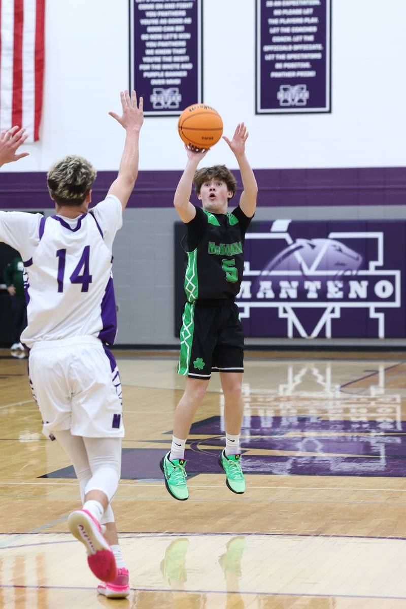 Bishop McNamara's Jayson Benton hits a 3-pointer during the Fightin' Irish's 61-24 victory over Manteno on Tuesday, Jan. 13, 2026.