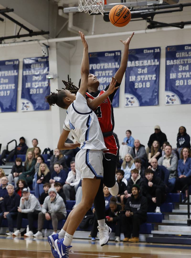 Bolingbrook's Sydney Dodd (4) attempts a shot during the girls varsity basketball game between Bolingbrook high school and Nazareth Academy on Monday, Jan. 12, 2026 in La Grange Park.