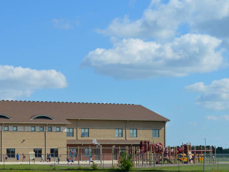 Children play after dismissal at Conley Elementary School in the Huntley School District 158 system on Wednesday, Sept. 1, 2021, in Algonquin. The McHenry County Department of Health has identified an outbreak of COVID-19 at the school.