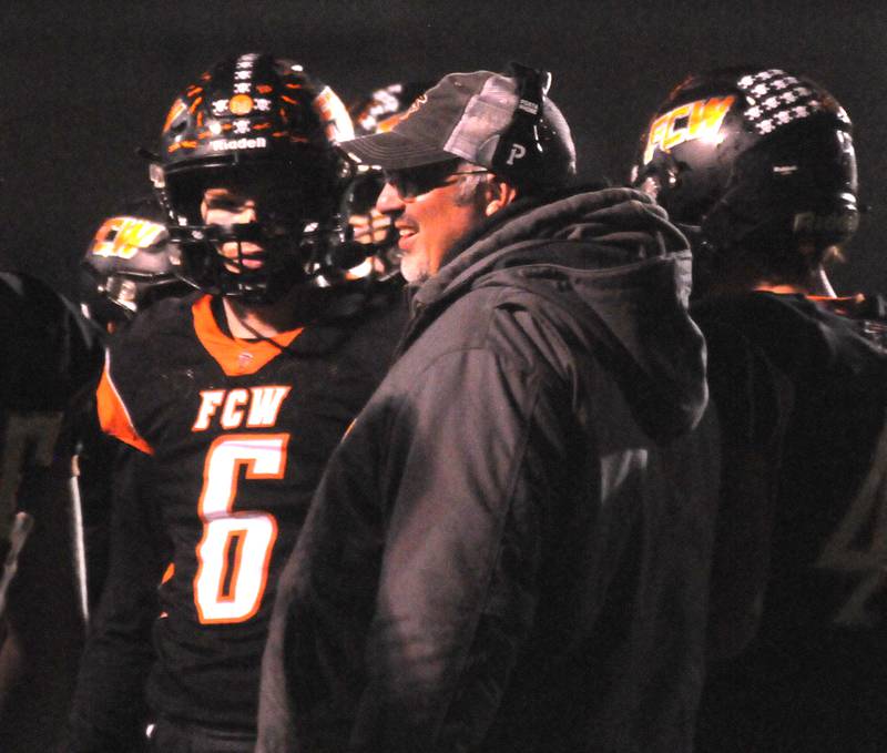 Flanagan-Cornell/Woodland head coach Todd Reed talks to his players at the Wood Shed on Friday, Oct. 13, 2023.